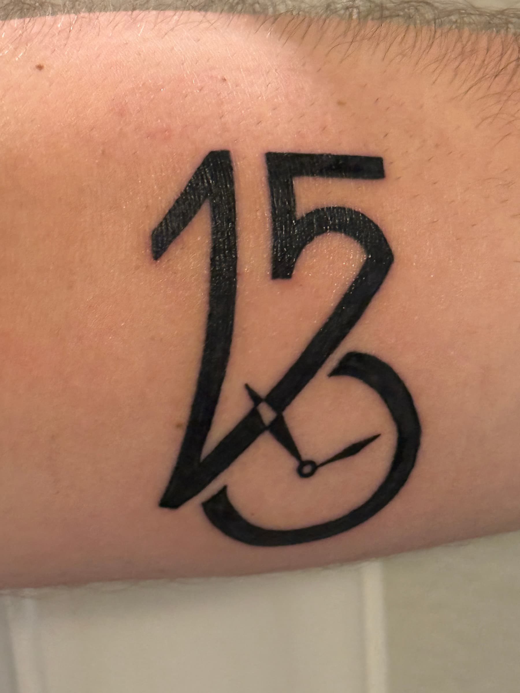 Close detail of the finished tattoo on skin, used to trace its three visual readings.